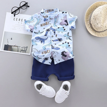 Laden Sie das Bild in den Galerie-Viewer, Dinosaur Print Short-sleeve Shirt and Solid Pants Set